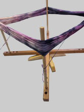 Load image into Gallery viewer, Wooden loom with purple yarn on a white wall background
