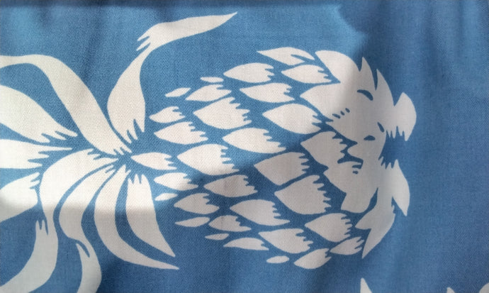100% cotton copen blue background with creamy white large scale print pineapple